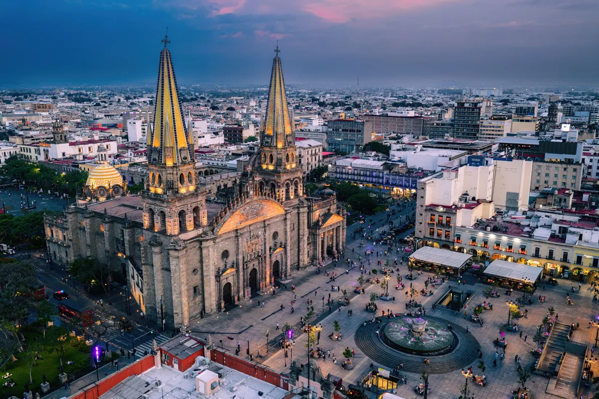 Guadalajara Cathedral and the plaza around it at dusk, seen from above